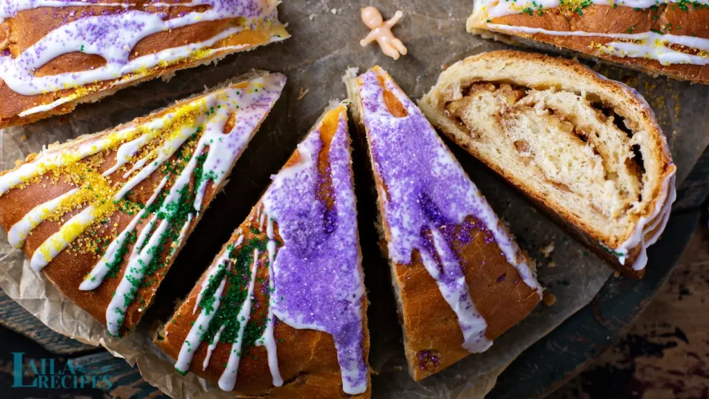 Applying icing to a cooled King Cake.