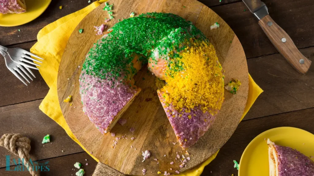 A baked King Cake cooling on a wire rack.