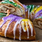 Shaping the filled dough into a ring for King Cake.