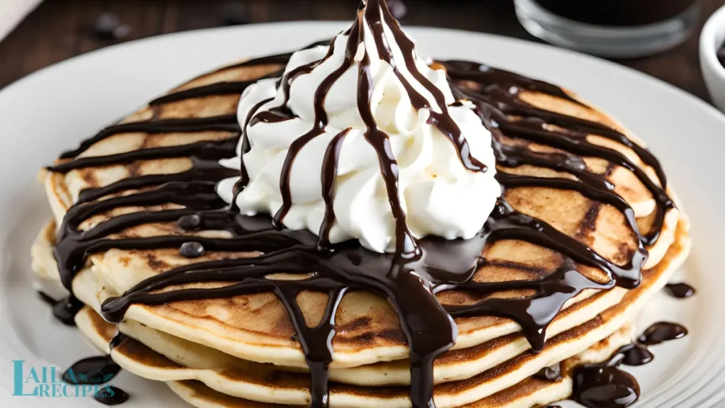 Pancakes topped with fresh berries and butter.