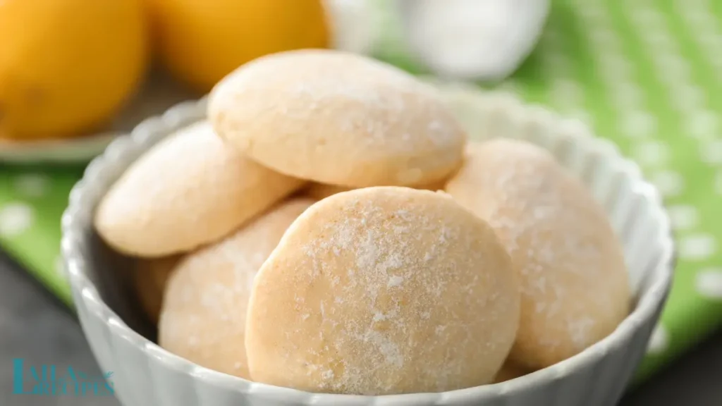 Soft lemon cookie broken in half, showing its texture