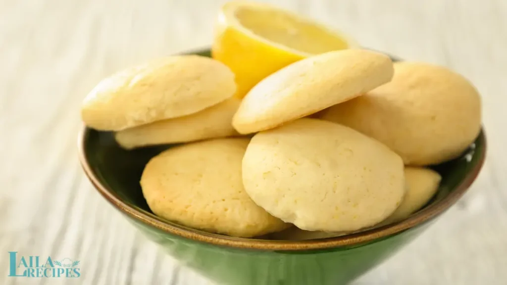 Freshly baked lemon cookies on a wire rack