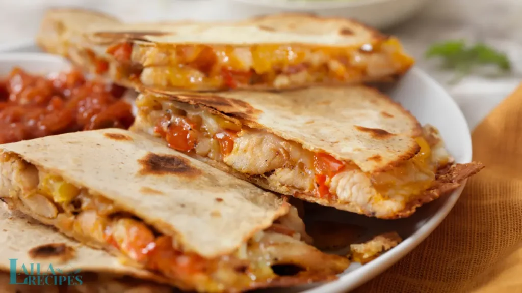 Golden brown quesadilla in a skillet with bubbling cheese.